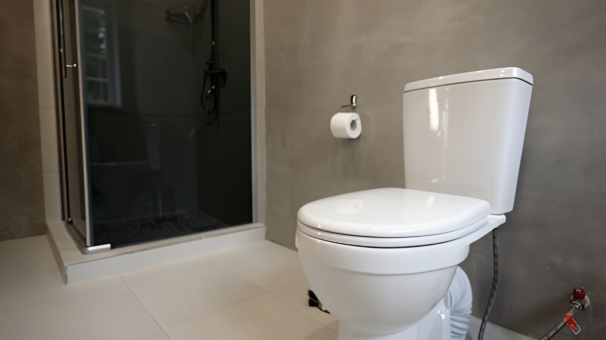 toilet next to a shower